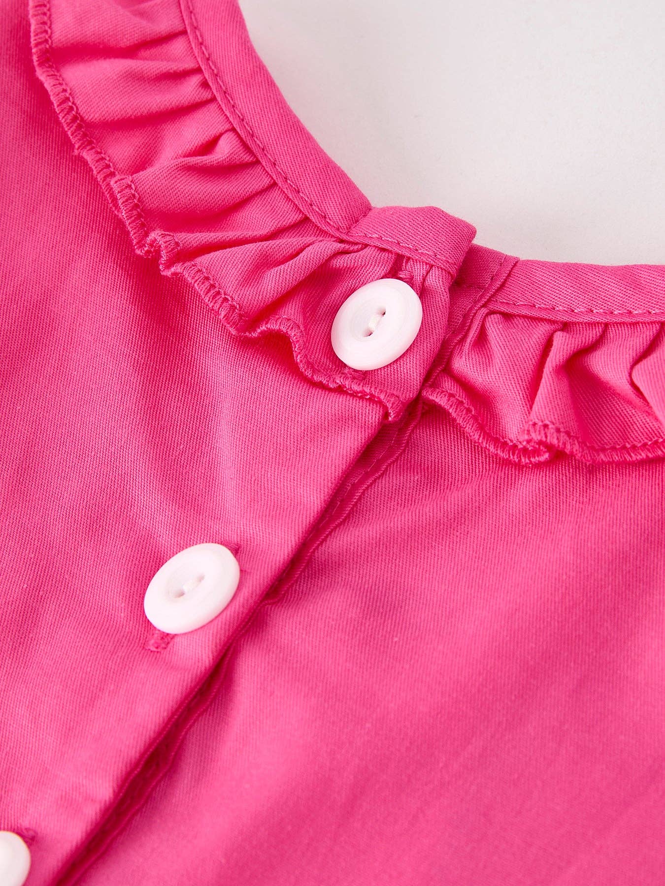 Pink Smocked Cross Romper